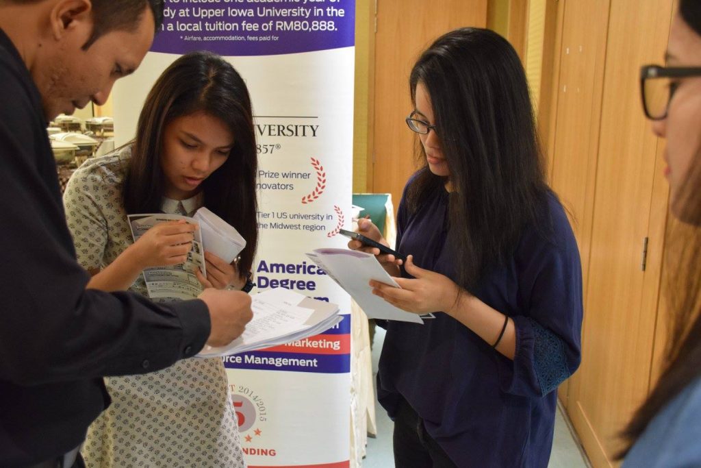 Students inquiring about further studies at the booths - HELP University, Berjaya University College of Hospitality and Manipal International University set up booths at the Ceremony. — at Federal Hotel, Kuala Lumpur.